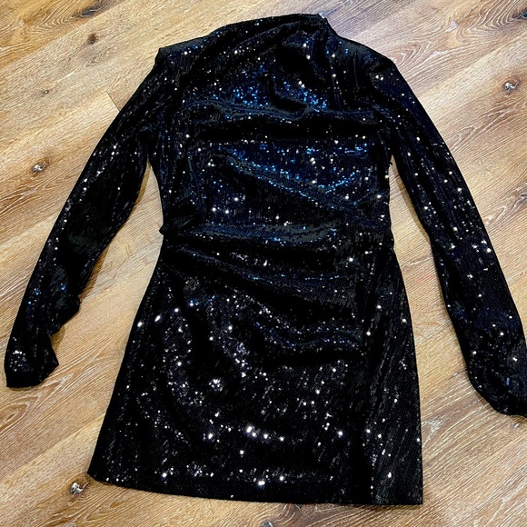 Black dress, goes down to knee. Would fit on you if you usually wear medium. - Picture 2 of 4